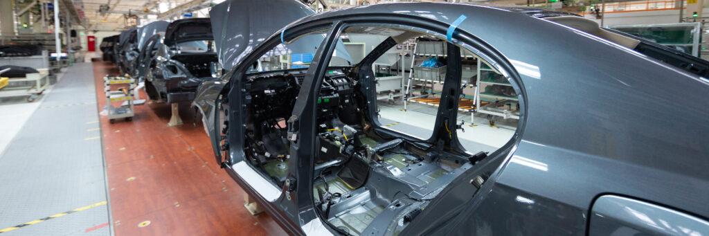 Frame of car body. long format. wide angle view of plant of automotive industry. can be used as banner